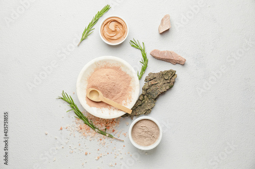 Composition with cosmetic clay on light  background