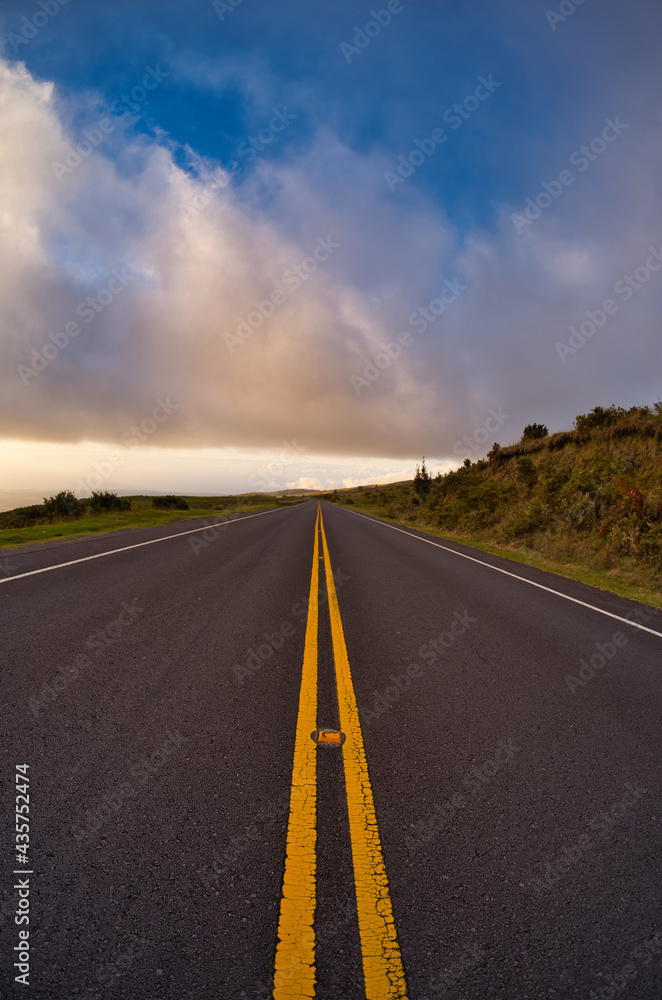 Solid yellow lines on road to top of Haleakala crater on Maui Hawaii 