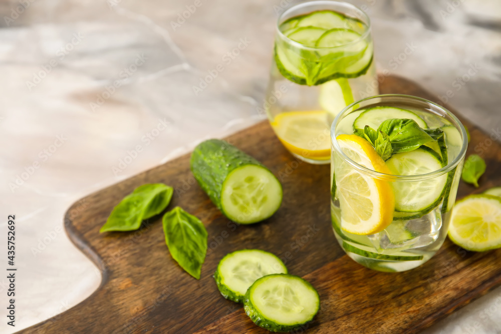 Glasses with cucumber lemonade on table