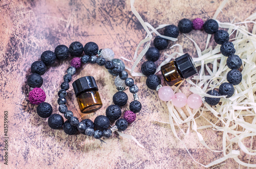 Bracelet made of lava with natural stones. Handmade jewelry bottle with essential oils.