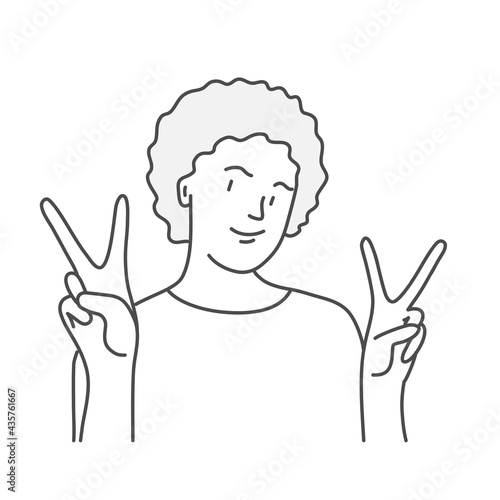 Cute woman shows victory gesture.