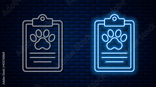 Glowing neon line Clipboard with medical clinical record pet icon isolated on brick wall background. Health insurance form. Medical check marks report. Vector