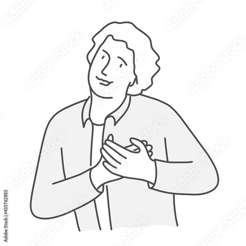 Happy man holding his hands to his chest.