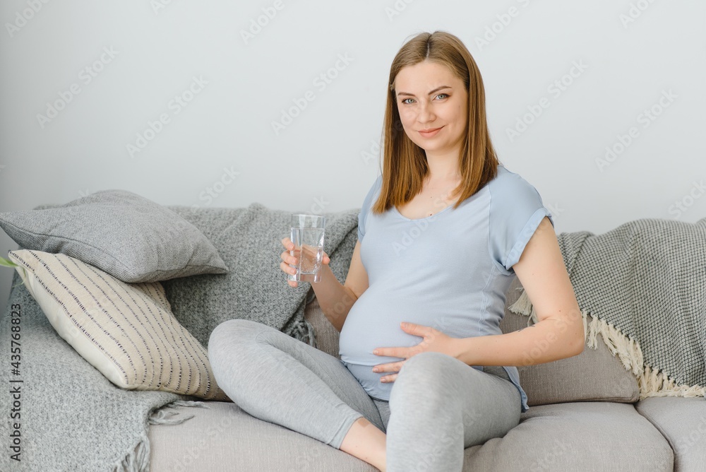 Portrait of a lovely pregnant woman drinking water Portrait of a lovely pregnant woman drinking water