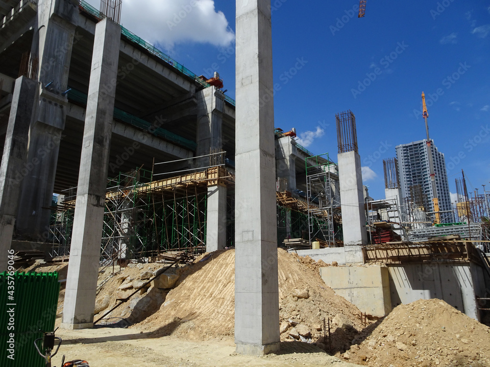 SEREMBAN, MALAYSIA -AUGUST 1, 2020: The concrete pillar structure is under construction at the construction site. The mold uses timber formwork and is temporarily supported with scaffolding.
