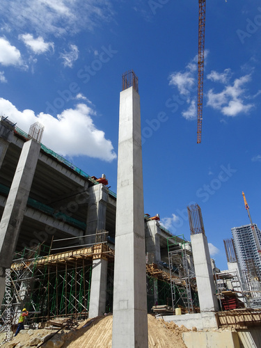 Wallpaper Mural SEREMBAN, MALAYSIA -AUGUST 1, 2020: The concrete pillar structure is under construction at the construction site. The mold uses timber formwork and is temporarily supported with scaffolding. Torontodigital.ca