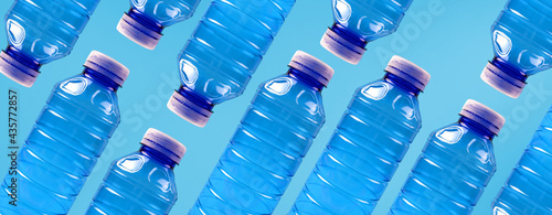 Eco banner. Concept of environmental protection and segregation of plastic waste. Plastic bottles on a blue background.