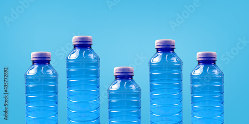Photos Plastic bottles on a blue background