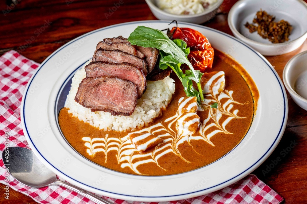 steak over rice with curry