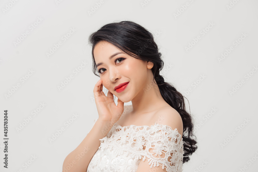 Portrait of beautiful elegant young Asian woman on white background. Portrait of beautiful elegant young Asian woman on white background.