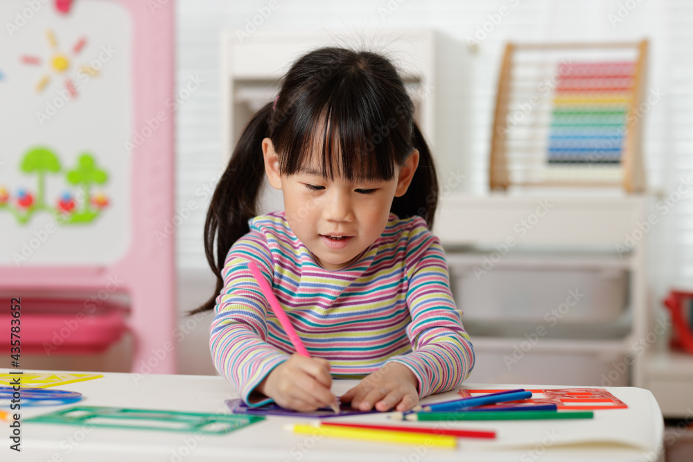 young girl drawing different shapes for homeschooling young girl drawing different shapes for homeschooling