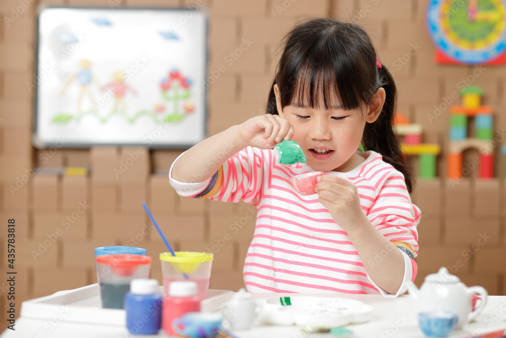 young girl painting tea set craft for homeschooling young girl painting tea set craft for homeschooling