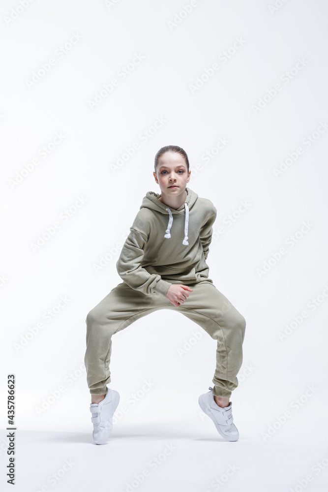 Young beautiful cool looking girl posing in studio Young beautiful cool looking girl posing in studio