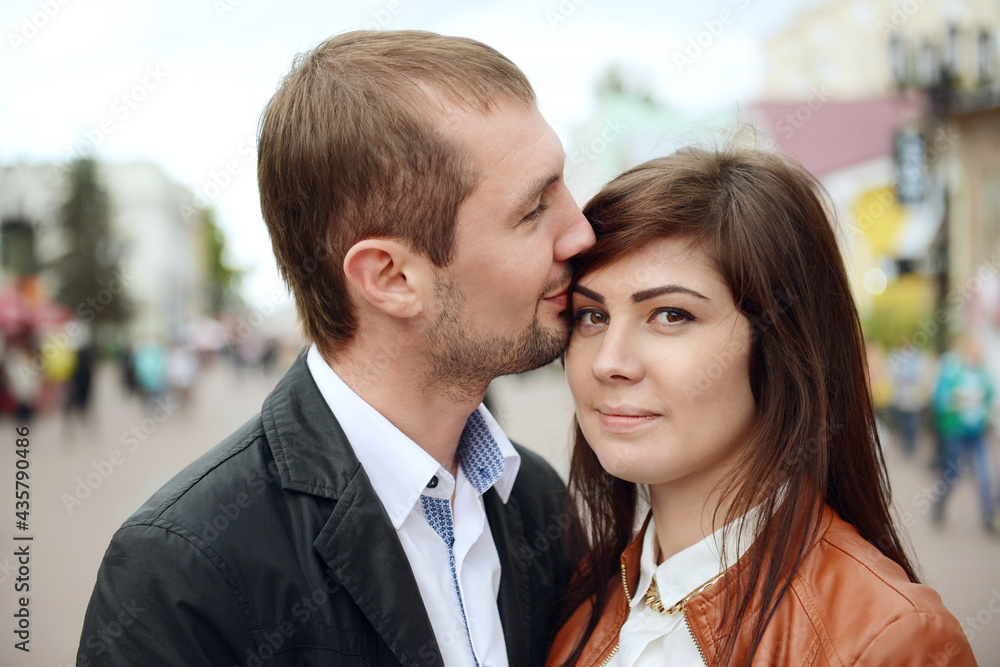 Young couple in love next to each other. Young couple in love next to each other.