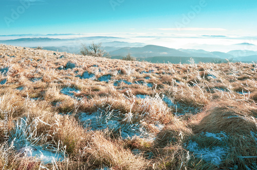 Mountain top in the late autumn with frost and snow, beautiful view photo