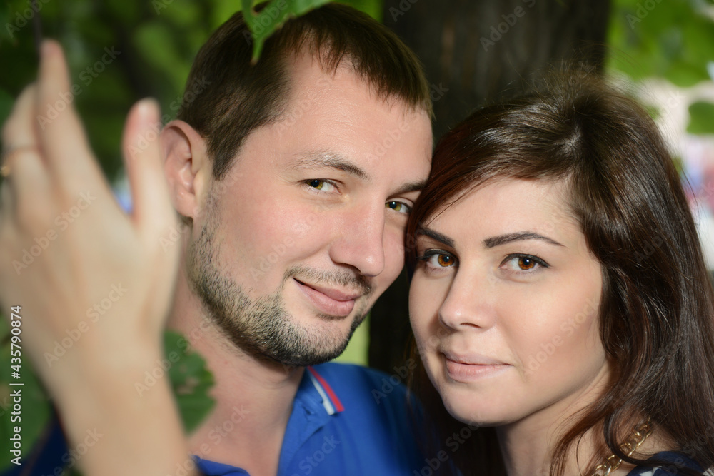 Portrait of a beautiful girl snuggled up to her boyfriend. Portrait of a beautiful girl snuggled up to her boyfriend.