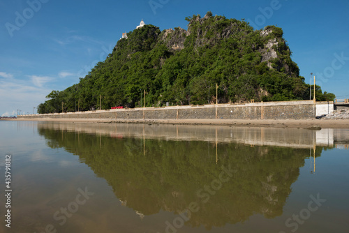 Reflection of  Chong krajok mountain,Landmark of Prachuap khirikhan province,Thailand. photo