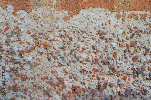 Close up of a brick wall. Texture of cement, stone and broken brick. Good for background