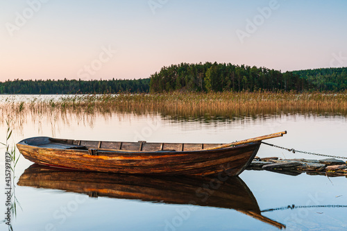 Wooden boat on still lake