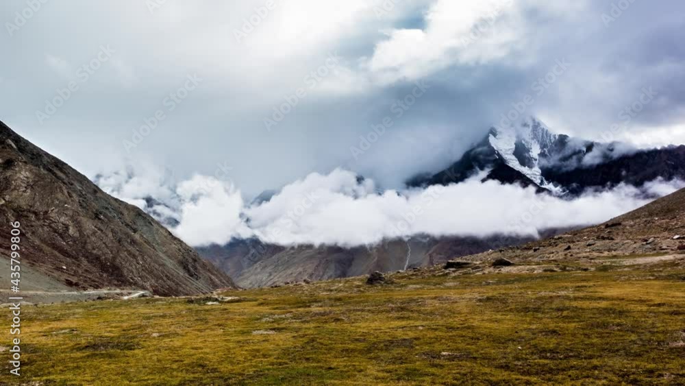 Time Lapse of Clouds Crawling through Milky Snowcapped Himalaya Mountains of Spiti Valley, Himachal Pradesh, India Time Lapse of Clouds Crawling through Milky Snowcapped Himalaya Mountains of Spiti Valley, Himachal Pradesh, India