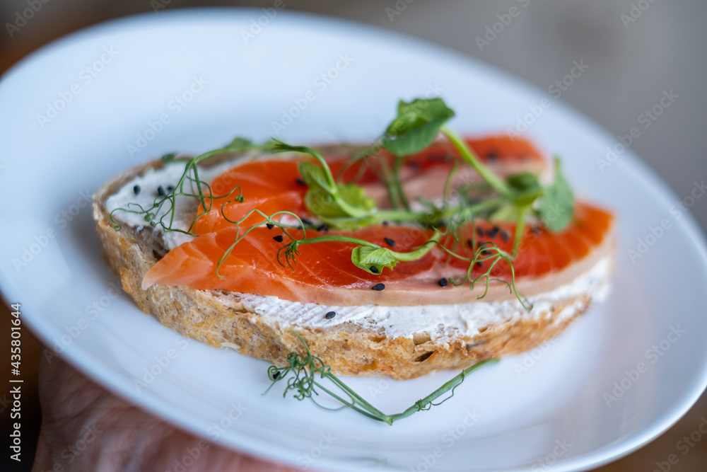 open sandwich with cereal bread and salmon, close up, selective focus open sandwich with cereal bread and salmon, close up, selective focus