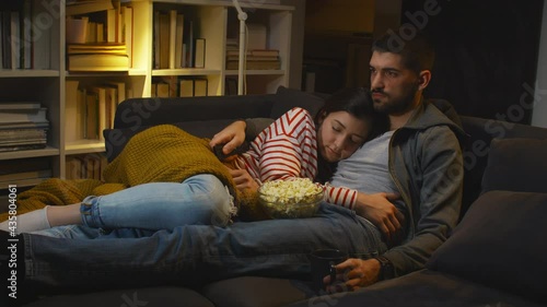 couple watching television at home