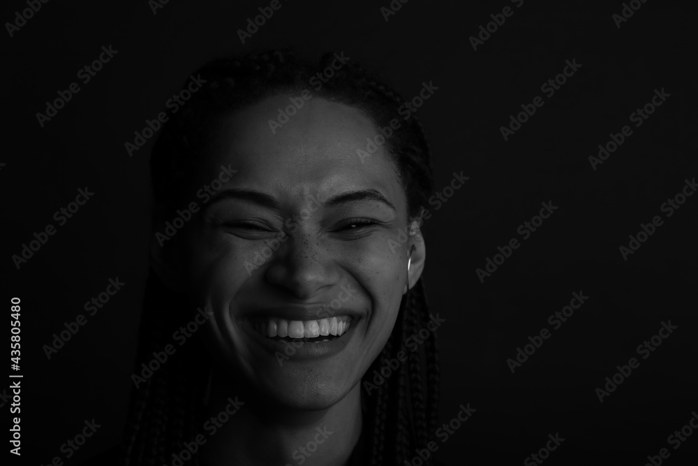 Laughing young curly woman in black and white Laughing young curly woman in black and white