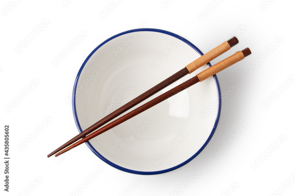 Top view of White bowl is empty, and chopsticks are placed on top of the bowl isolated on a white background. Top view of White bowl is empty, and chopsticks are placed on top of the bowl isolated on a white background.