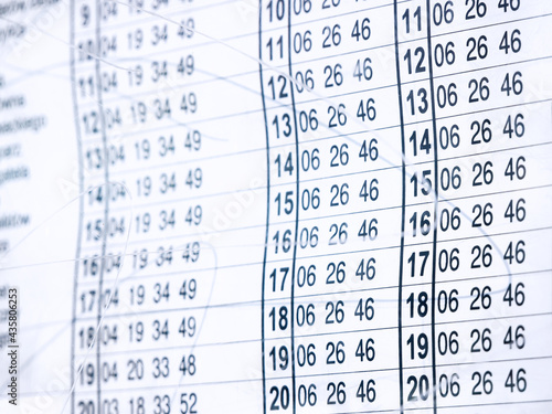 Billede på lærred Public transportation, tram, bus stop paper timetable object detail, closeup
