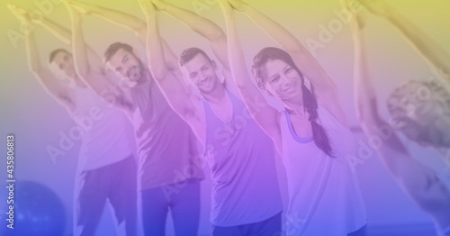 Composition of men and women practicing yoga on purple tinted background
