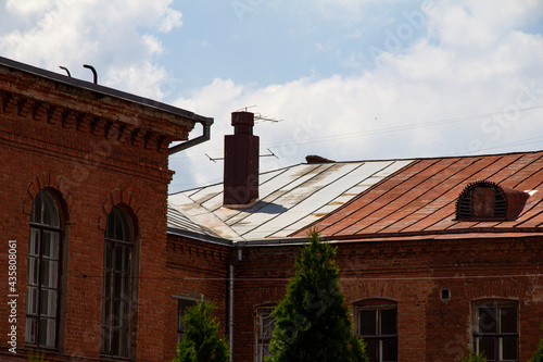 The roof of an old building, a red building, a red brick