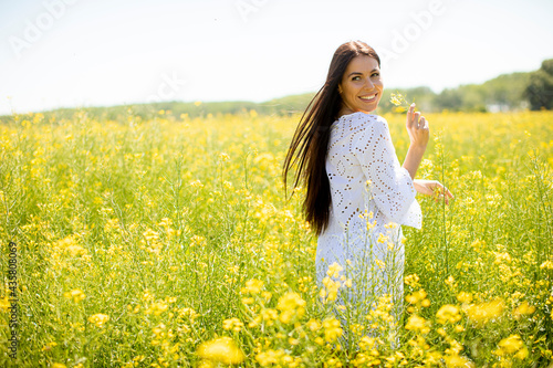 Young woman in the rapeseed field © BGStock72