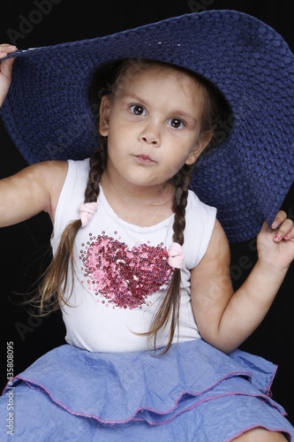 little girl in a hat