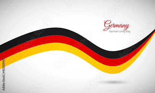 Happy german unity day of Germany. Creative shiny wavy flag background with text typography.