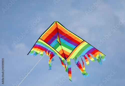 colorful kite flies high in the sky symbol of freedom and joy