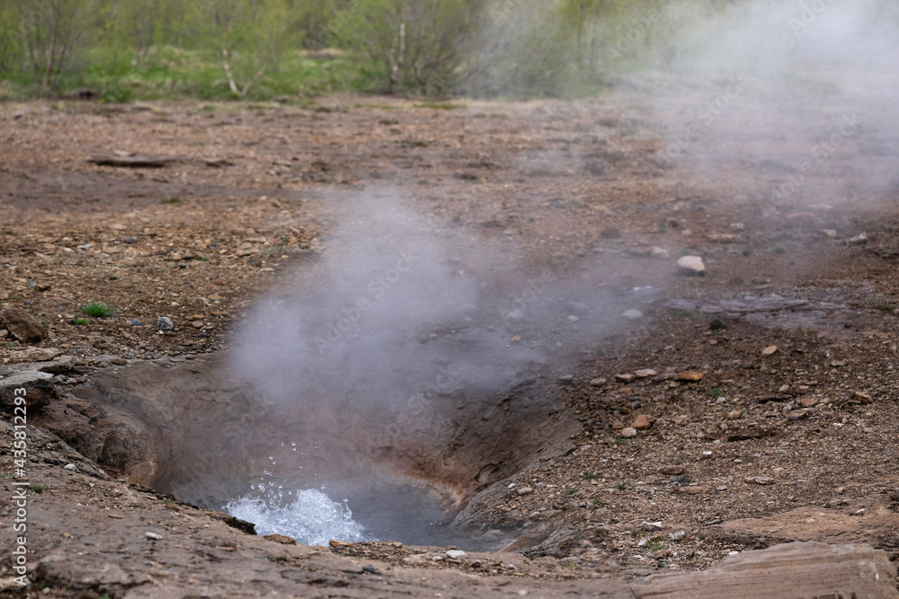 Geyser in Iceland is still bubbling after an eruption in a volcanic landscape in Iceland