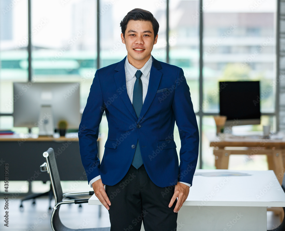 Smiling ethnic businessman in office Smiling ethnic businessman in office