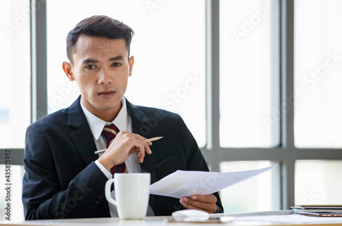 Businessman taking notes in office