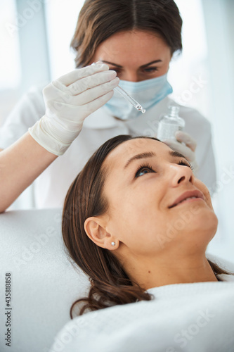 Woman undergoing a cosmetic procedure in a beauty spa salon