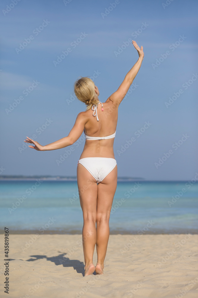 young woman with athletic body in bikini young woman with athletic body in bikini