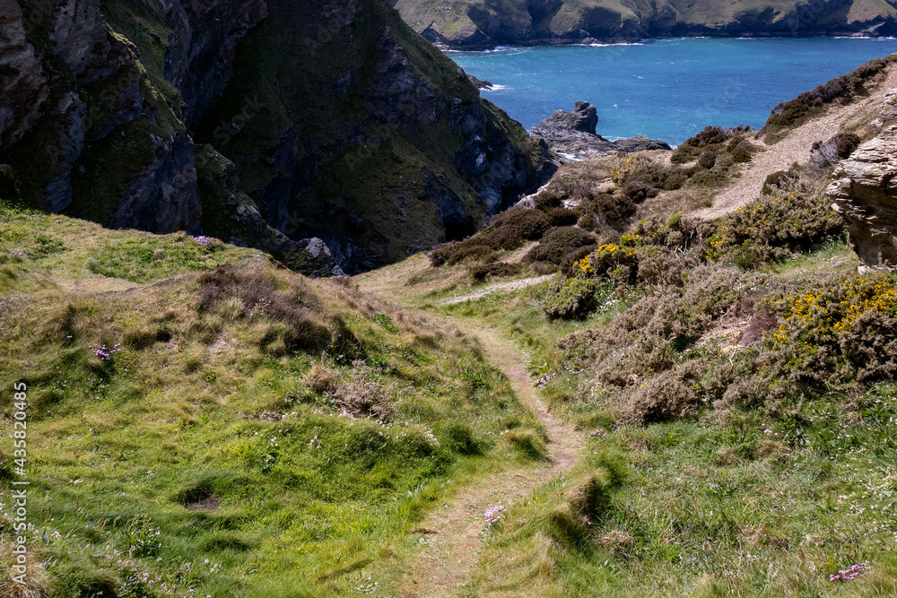 Grassy track leading down to Hells Mouth near Hayle in Cornwall