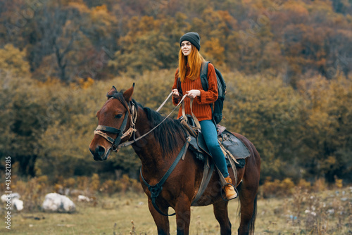 woman riding a horse on nature mountains travel adventure © SHOTPRIME STUDIO