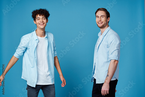 good friends in shirts on a blue background communication greeting party