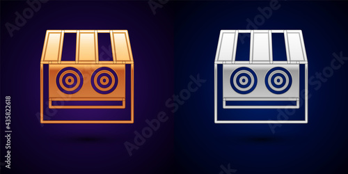Gold and silver Shooting gallery icon isolated on black background. Shooting range. Vector