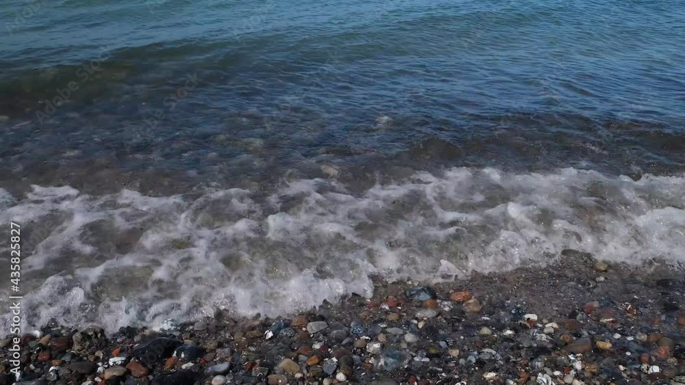 The rocky coast of the Baltic Sea and waves beat against stones. The rocky coast of the Baltic Sea and waves beat against stones.