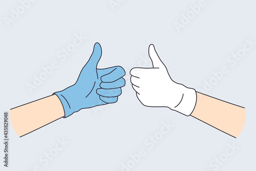 Positive emotions in gestures concept. Human hands in blue and white latex gloves showing thumb up sign vector illustration 