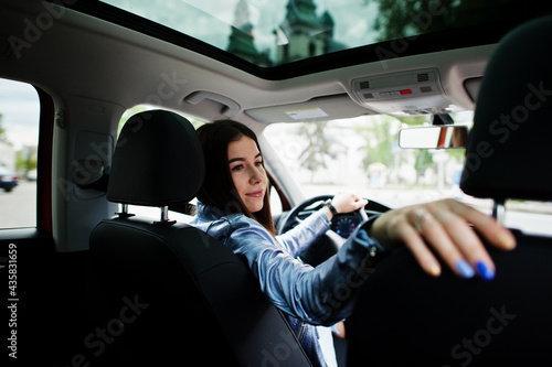 Gorgeous woman sitting inside car interior. © AS Photo Family