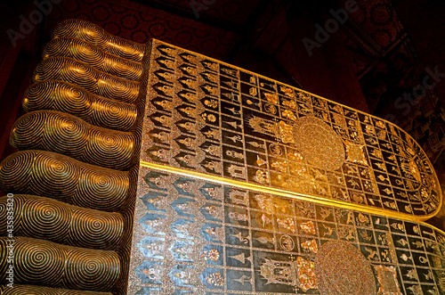 Soles of Reclining Buddha's Feet Inlaid 108 Auspicious Symbols with Mother of Pearl, Wat Pho Temple, Bangkok, Thailand photo