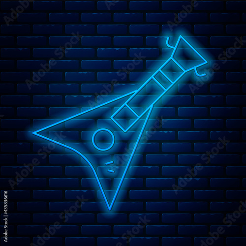 Glowing neon line Electric bass guitar icon isolated on brick wall background. Vector