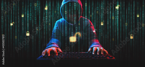 Hacker on screen with binary code. photo